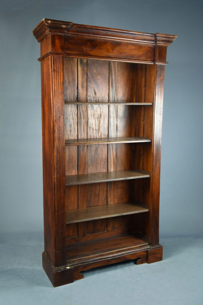 Tall mahogany open bookcase with fluted columns & shaped feet. The Classic Prop Hire Company